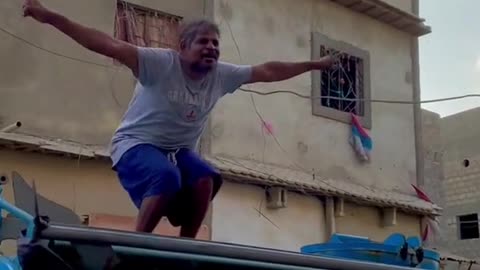 old man dancing on truck