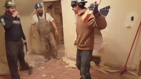 Construction Worker Breaks through Wall