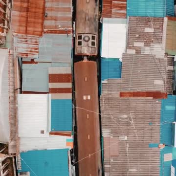 stop scrolling and watch the train passing through mae klong market