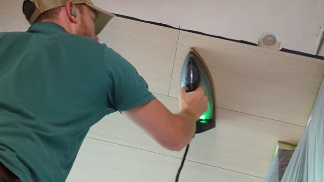 Wood veneering a ceiling