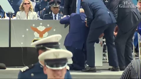 Joe Biden falls on stage at US air force academy ceremony