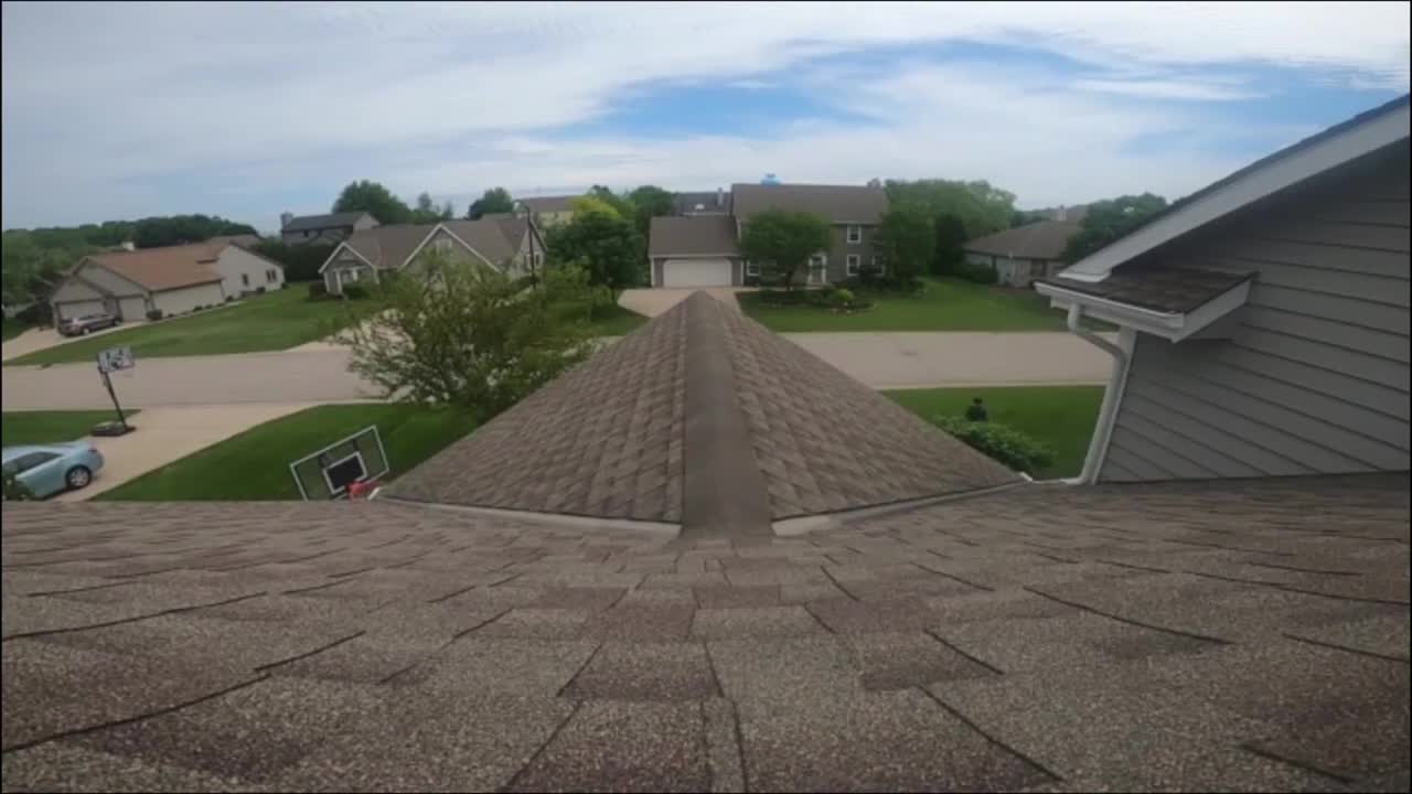Guy Shot Basketball Over The House Roof And Scores
