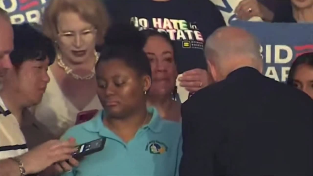 Racist Joe Biden rejects a selfie with the only Black girl in the crowd, but happily