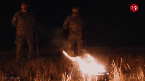 Gathering around bonfire, "Azov" fighters remember their fallen fellow soldiers