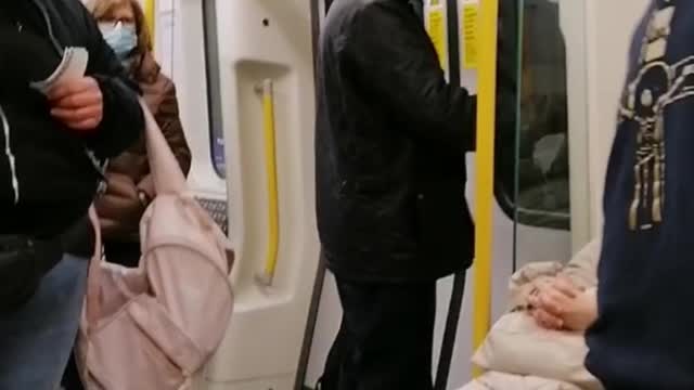 Man Boldly Waking The Sheep Up On The Train