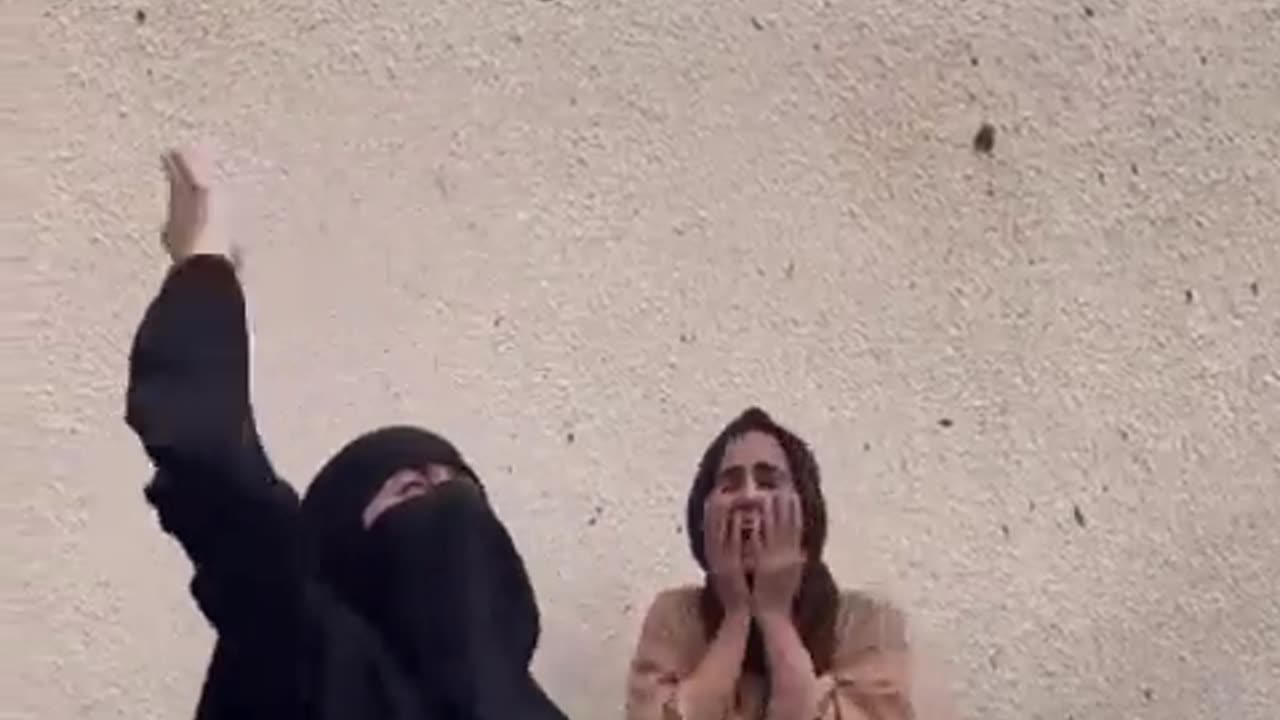 Palestinians cry in pain over their sister, who was killed by Israeli occupation airstrike