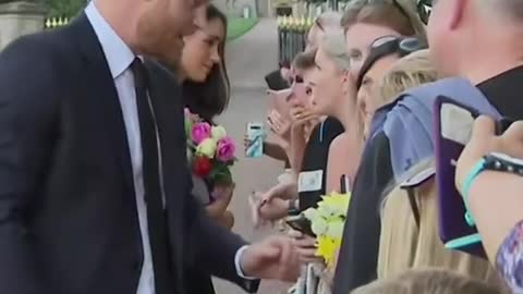 Prince Harry, Meghan,Prince William and PrincessKate greet crowd atWindsor Castle