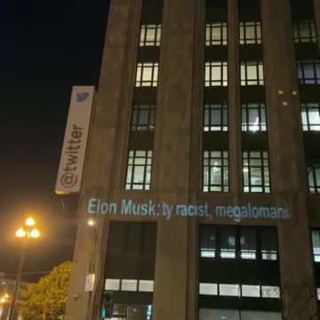 Anti Elon Musk Messages projected onto Twitter's San Francisco headquarters