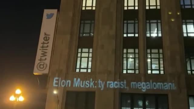 Anti Elon Musk Messages projected onto Twitter's San Francisco headquarters