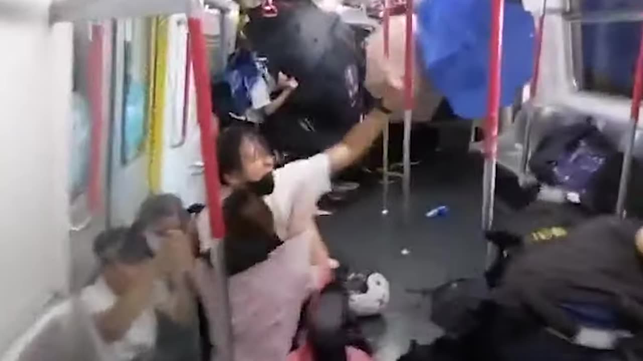 Police in Hong Kong beat up protesters on train