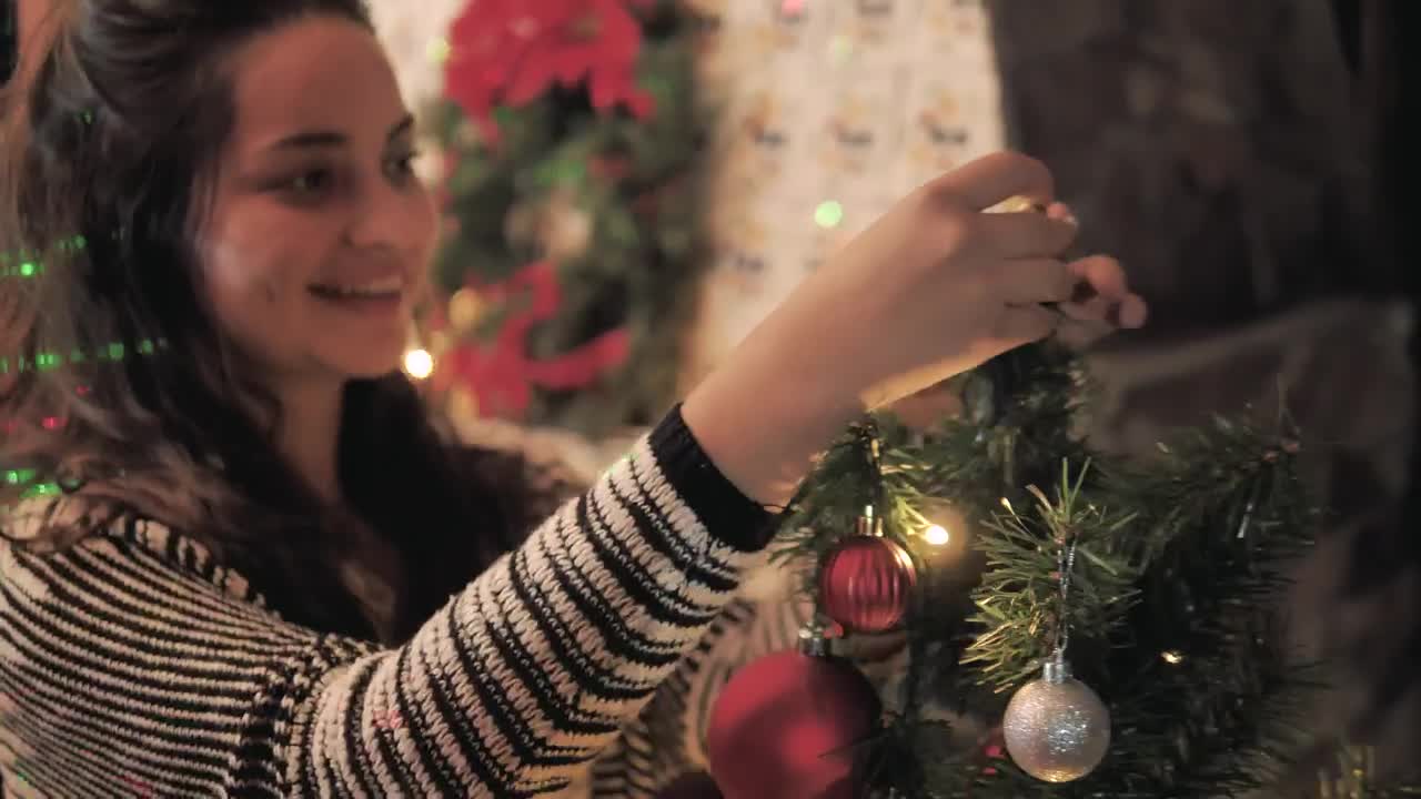 Woman decorating her home for Christmas