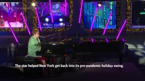 Elton John unveils Saks' holiday display