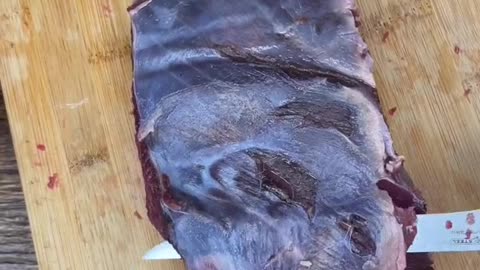 Cleaning up a bottom round roast from a deer