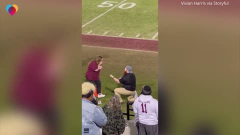 High school football team goes wild after coach proposes to girlfriend