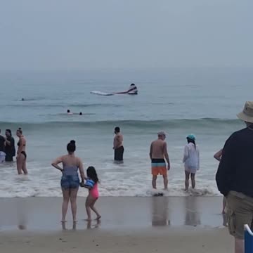 Small plane crashes Into surf at New Hampshire's Hampton Beach