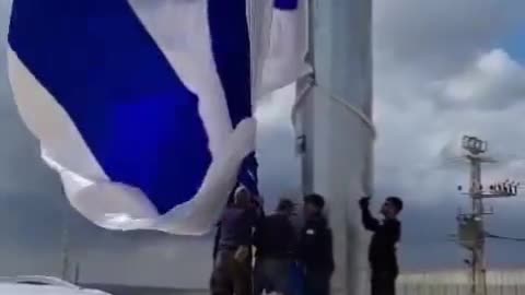 A HUGE flag of Israel now stands where Hamas terrorists brutally murdered 20