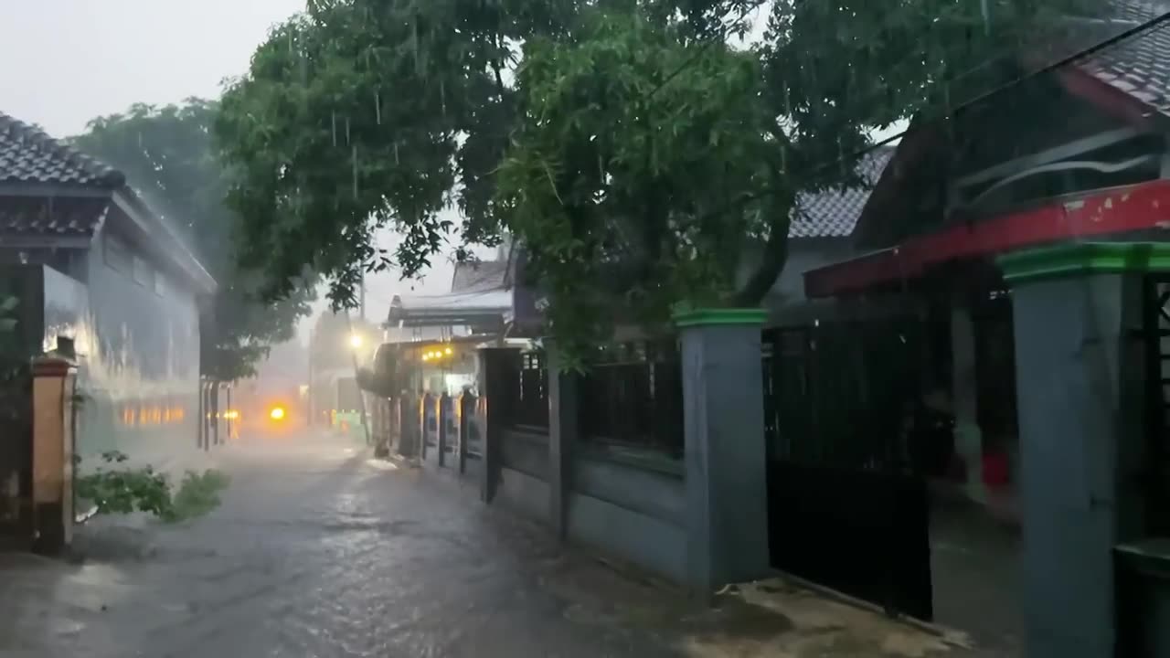 Heavy rain brings coolness in the afternoon__Indonesian rural atmosphere when it rains.