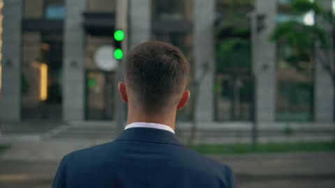 Man dressed in suit crossing the street
