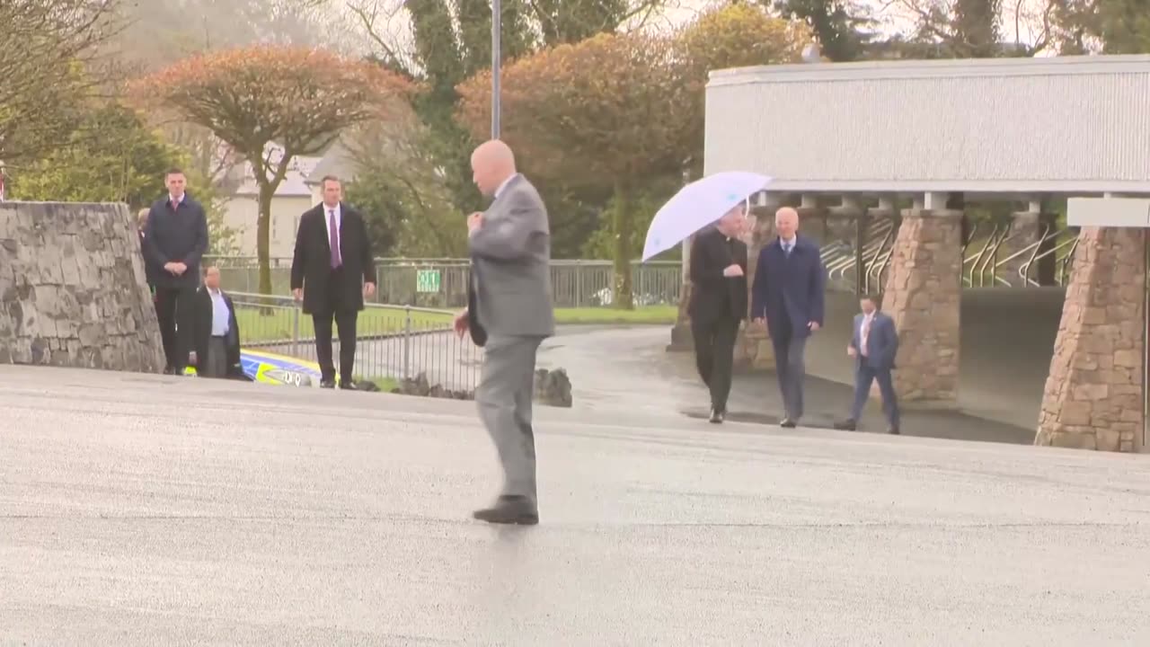 Karine Jean-Pierre With Commentary During Biden Ireland Trip: "Walking...Walking Under The Umbrella"