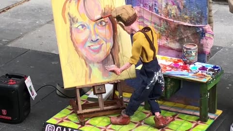 Street Artist Paints With Marionette Puppet