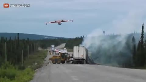 Water Bomber swoops down and puts out a truck fire