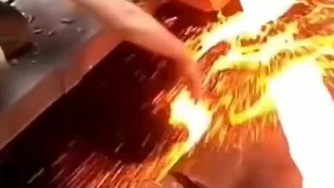 Molten metal with bare hands. Lava