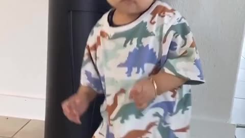 Watch this adorable baby girl light up the room with her sweet dance moves. 💃✨"