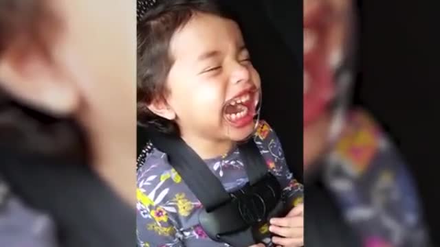 Girl Laughs While Wearing Mouthpiece