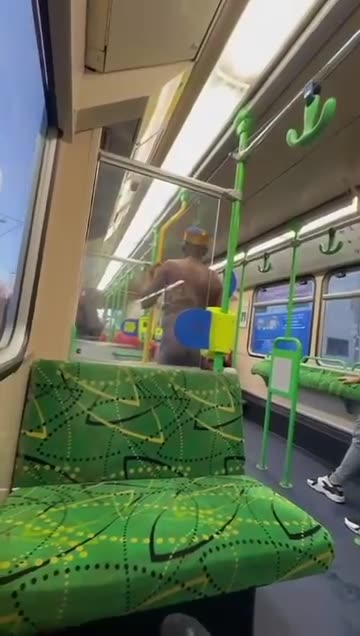 Fed-up Aussie passenger kicks naked African man off a Melbourne tram