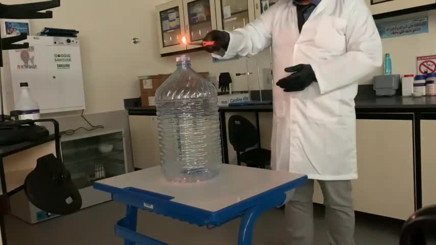 Guy Form Blazing Fire in Plastic Bottle While Performing Scientific Experiment