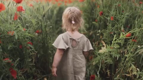 Baby girl walking in the garden