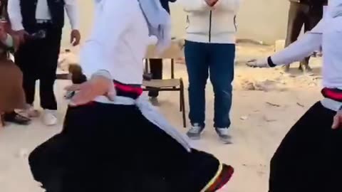 Algeria: men dancing