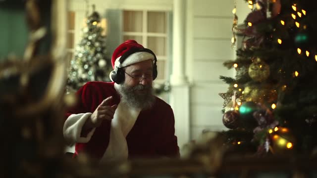 Santa Claus Singing And Dancing With The Music From His Headphone