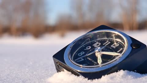 Alarm clock in the snow