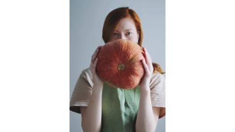 Here we have a pumpkin plant and a woman