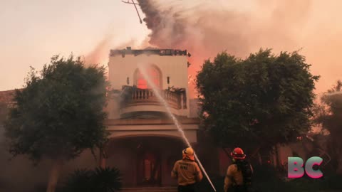 Southern California wildfire rages as it engulfs homes, forces mass evacuations