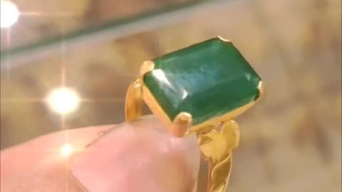 beautiful gold ring with green stone