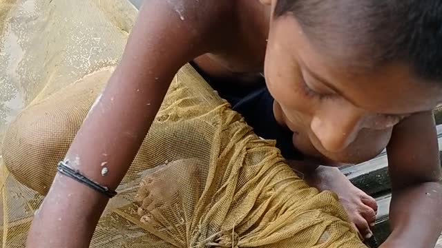 Little boy catching fish 🙂