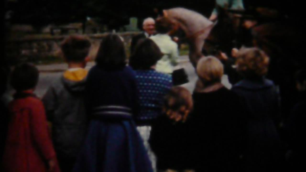 Unloading ship (spuds?), Seamer schoolkids hunting for pennies.