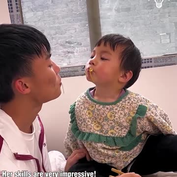 This little girl can eat food all on her own!.hd
