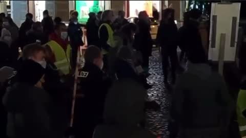 Germany Police measure protesters stay 6 feet apart tonight, while they protest for Freedom tonight