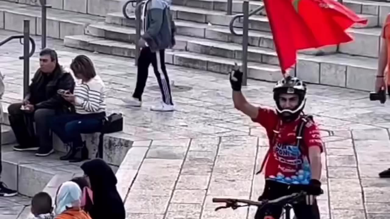 Morrocan flag waved by a Palestinian in the occupied city of Jerusalem