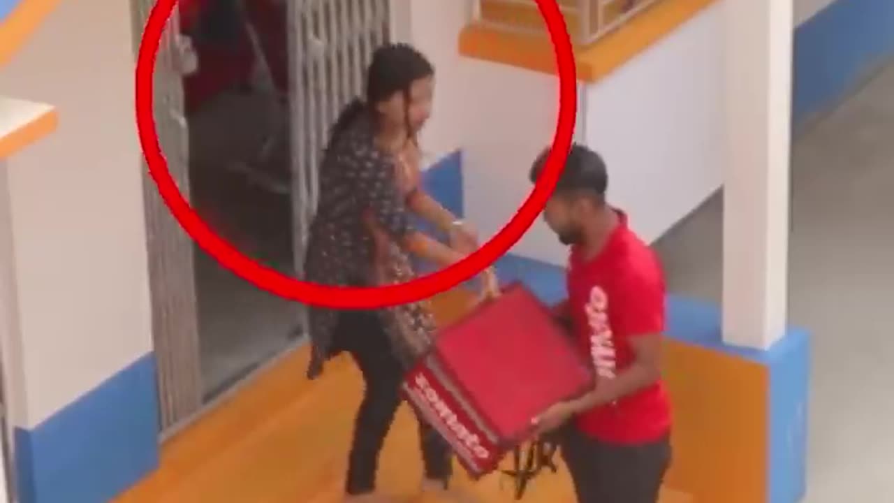 A lady force to a food delivery person
