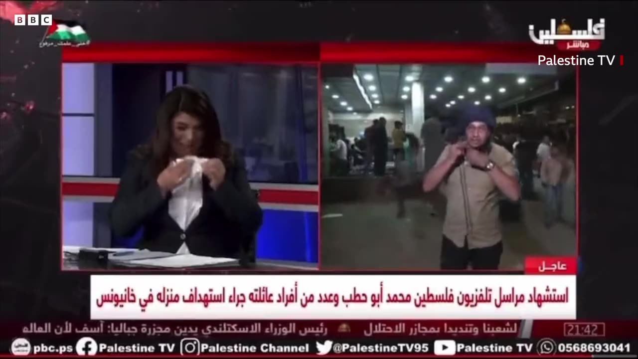 Gaza reporter removes protective vest after learning of colleague's death