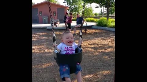 The babies play on the swing