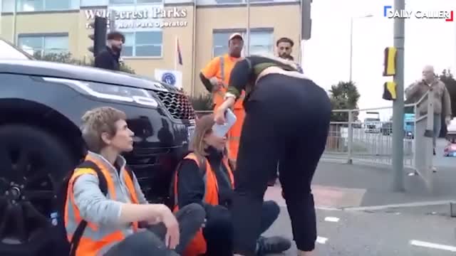 Guy Tosses Street-Blocking Protesters Off The Road