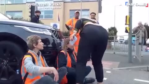 Guy Tosses Street-Blocking Protesters Off The Road