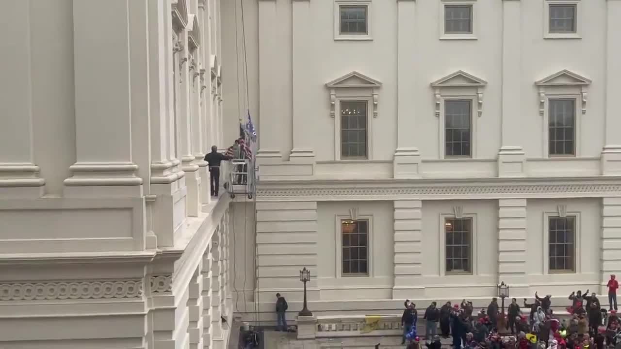 Several people got on to a scaffolding outside Senate