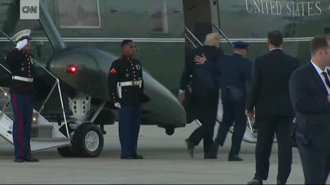 Trump stops to retrieve Marine's hat_1