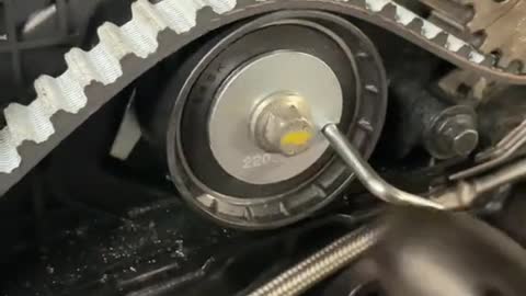 Automobile engine belt adjustment